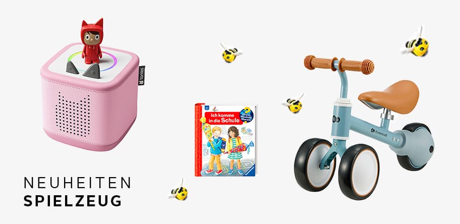 Neuheiten Spielzeug – rosa Toniebox mit Figur, Schulbuch und dreirädriges Fahrrad vor weißem Hintergrund mit Bienen-Deko