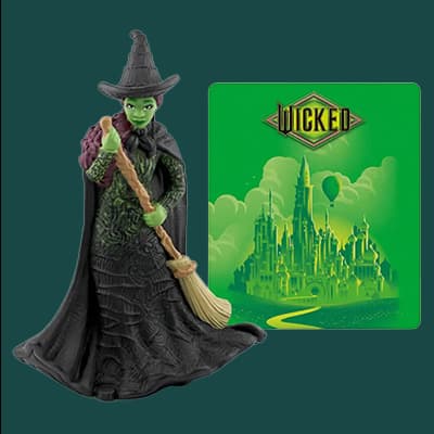 Wicked – grüne Hexenfigur mit Besen vor grünem Schloss aus dem Musical