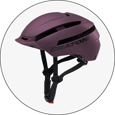Lila Fahrradhelm mit schwarzen Belüftungsschlitzen und schwarzem Logo "CRATONI"