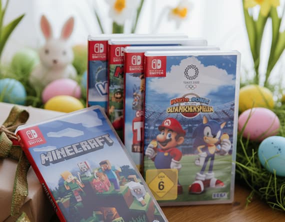 Nintendo Switch Spiele, darunter Minecraft und Mario & Sonic bei den Olympischen Spielen, vor Osterdekoration