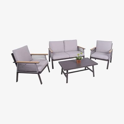 Garten-Lounge-Set mit Sofa, zwei Sesseln und rechteckigem Tisch, kleine Pflanze steht auf dem Tisch